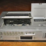 Picture of an old, top-loading, VCR.