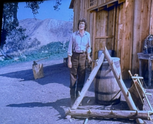 In the School Mom episode of Little House on the Prairie, Pa is making something out of logs.